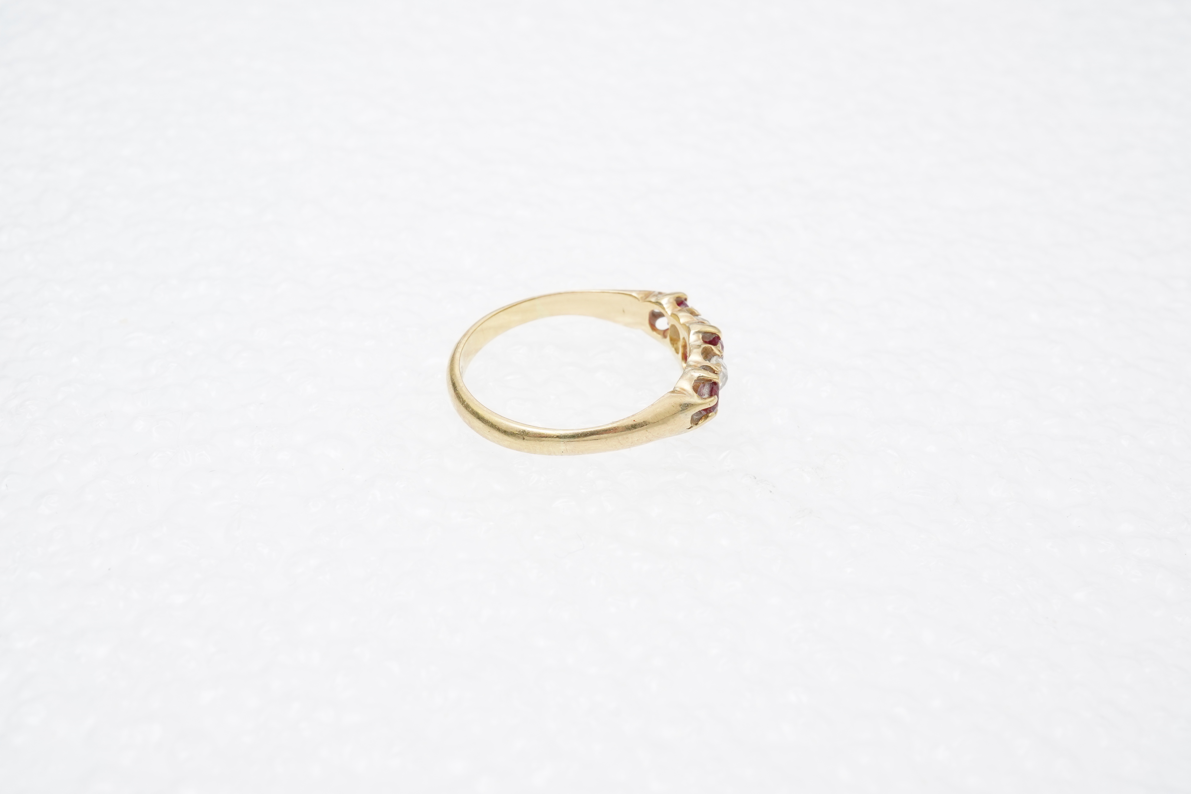 A ruby and diamond five-stone ring, circa 1900